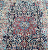 This vintage Persian Kashmar carpet is a remarkable piece, boasting a spacious size and meticulous craftsmanship using natural fibres