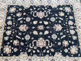 Decorative Afghan Chobi rug with intricate patterns on a dark background