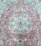 Floral patterned Persian Kashmar rug with intricate design on a pink background