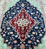 Decorative traditional Afghan Roshnai rug with intricate patterns and colors on a blue background