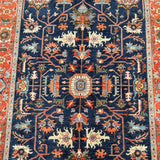 Close-up of an intricately designed Afghan Super Kazak rug with a blue background and colorful patterns.