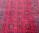 A rectangular, flatweave, tribal-style Afghan rug with a burgundy and multicolor geometric pattern at Persian rug warehouse WA in Perth.