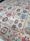 Decorative Afghan super Kazak rug with intricate patterns and colors on a neutral background