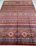 Multicolored striped shawl patterned Afghan super Kazak rug with geometric designs.