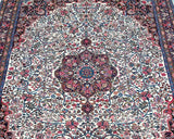 Close-up of a Floral patterned Persian Bijar rug with intricate designs and colors.