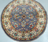 This elegant round Afghan Chobi rug hand knotted using a soft wool pile on a durable cotton foundation. Crafted in Afghanistan by skilled artisan weavers.