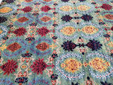 A hand-knotted Afghan Chobi rug, multicolored floral design on a rug, featuring a variety of geometric and botanical patterns.