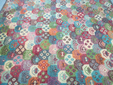 A multicolored geometric boho design woolen Moroccan rug.