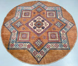 Round Afghan Kazak rug with geometric pattern on a caramel background