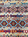 Colorful geometric patterned Afghan Boho Kilim Rug  with a variety of colors.