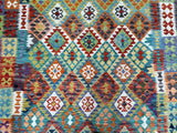 Multicolored geometric patterned boho Kilim rug with various colors.