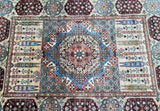 A close-up view of a section of an Afghan Mamluk Kazak rug, displaying a traditional geometric pattern with multiple colors including beige, orange, yellow, green, brown, and blue.