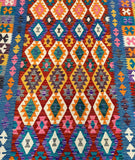 Multicolored geometric Afghan kilim patterned rug with vibrant colors