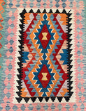 Colorful geometric Afghan Kilim rug with a prominent diamond design At Persian rug warehouse WA