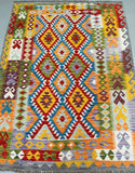 Colorful geometric patterned kilim rug with vibrant colors