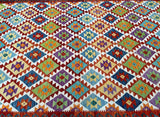 Close-up view of a colorful geometric patterned hand-woven Afghan Waziri Kilim Rug.