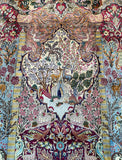 A detailed and colorful Persian Kashmar rug featuring a garden of paradise design with floral patterns and wildlife motifs on a blue background.