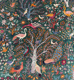 Colorful oriental rug with birds, trees, and flowers on a dark green background