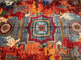 A Transitional Afghan Mamluk rug Featuring Aligned Geometric Medallions With Intricate Latticework Motifs Set Within A Distressed Abstract Background