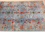 An Elegant All-Over Floral Design Afghan Chobi rug With A Central Medallion