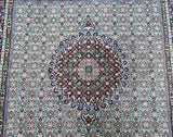 Close-up of a square size Persian Birjand rug 2x2m showcasing a detailed herati pattern with beige, blue, green, mustard, brown, orange, and pink colors.