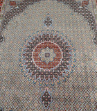 A hand-knotted Persian Birjand rug with a central medallion fish design, featuring a variety of colors including beige, gold, blue, terracotta, red, pink, orange, and black.