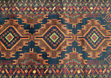 A vintage Afghan Balouchi rug with a geometric triple medallion design in multiple colors including blue, mustard, brown, green, black, and red, hand-knotted on a woolen fabric.