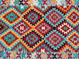 Colorful geometric Afghan Kilim with a diamond and zigzag design.