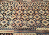 Close-up of a tribal patterned vintage kilim rug with geometric design
