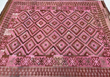 Pink and brown vintage Afghan Kilim rug with geometric design