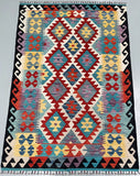 Colorful geometric patterned rkilim rug with vibrant colors Perth