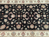 A 4m long oriental hall runner featuring a floral pattern with a black, beige, pistachio, and pink color scheme, woven on a cotton base.