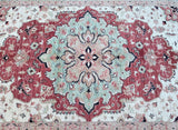 A traditional hand-woven Afghan Chobi rug featuring a central medallion floral design with terracotta, beige, black, and green tones.
