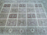 A room-size hand-knotted Afghan Chobi rug in pastel beige, soft pink, and light brown tones, featuring traditional geometric patterns.
