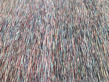 A close-up view of a contemporary Afghan Gabbeh rug featuring a dense, patterned design with beige, maroon, brown, green, and blue tones.