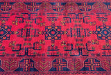 A hand-knotted tribal Afghan Khal hall runner with a burnt terracotta/maroon tone, featuring a geometric and floral design with broken branch motifs.