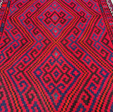 A vibrant, multicolored wool Afghan Meymana Kilim rug with a geometric tribal design featuring diamonds and medallions at Persian rug warehouse WA in Perth
