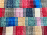 A multicolored hand-knotted Afghan royal Kazak rug with a modern checker design, featuring a variety of colors on a cotton base.