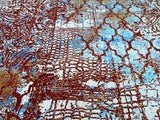 Close-up view of a traditional hand-woven Afghan Chobi rug featuring geometric patterns in beige, blue, and brown/terracotta tones.